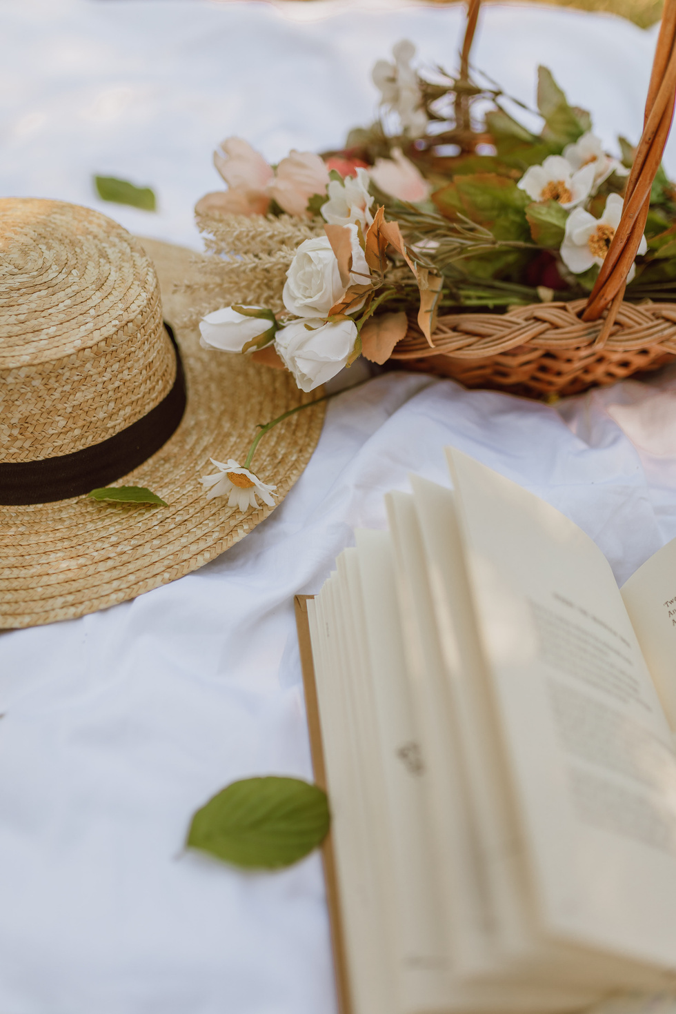 Book, Flowers, and Hat on a Blanket